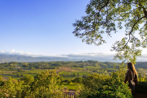 Woman standing over farm