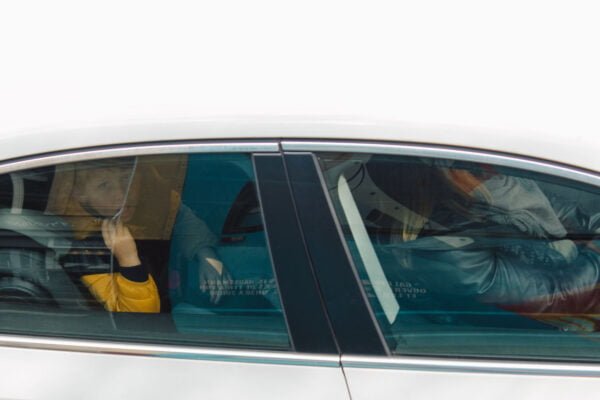 Boy in car looking up