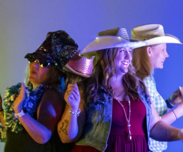 Three women in cowboy hats
