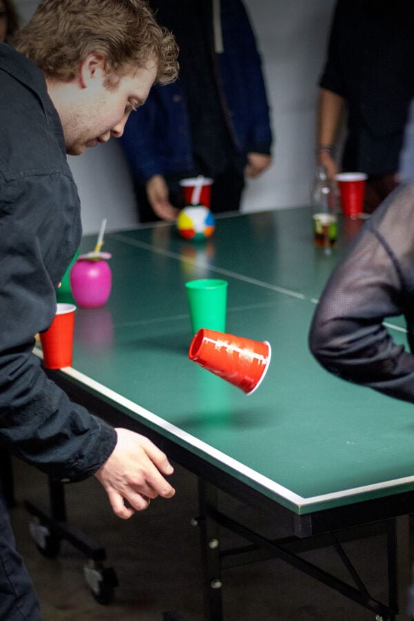 Man playing flip cup