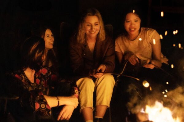 Teens around campfire