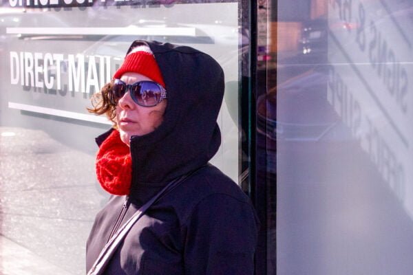 Woman standing in front of store